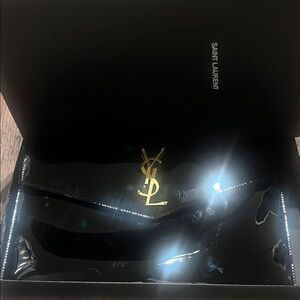 Saint Laurent Glossy Black Clutch with Gold Logo